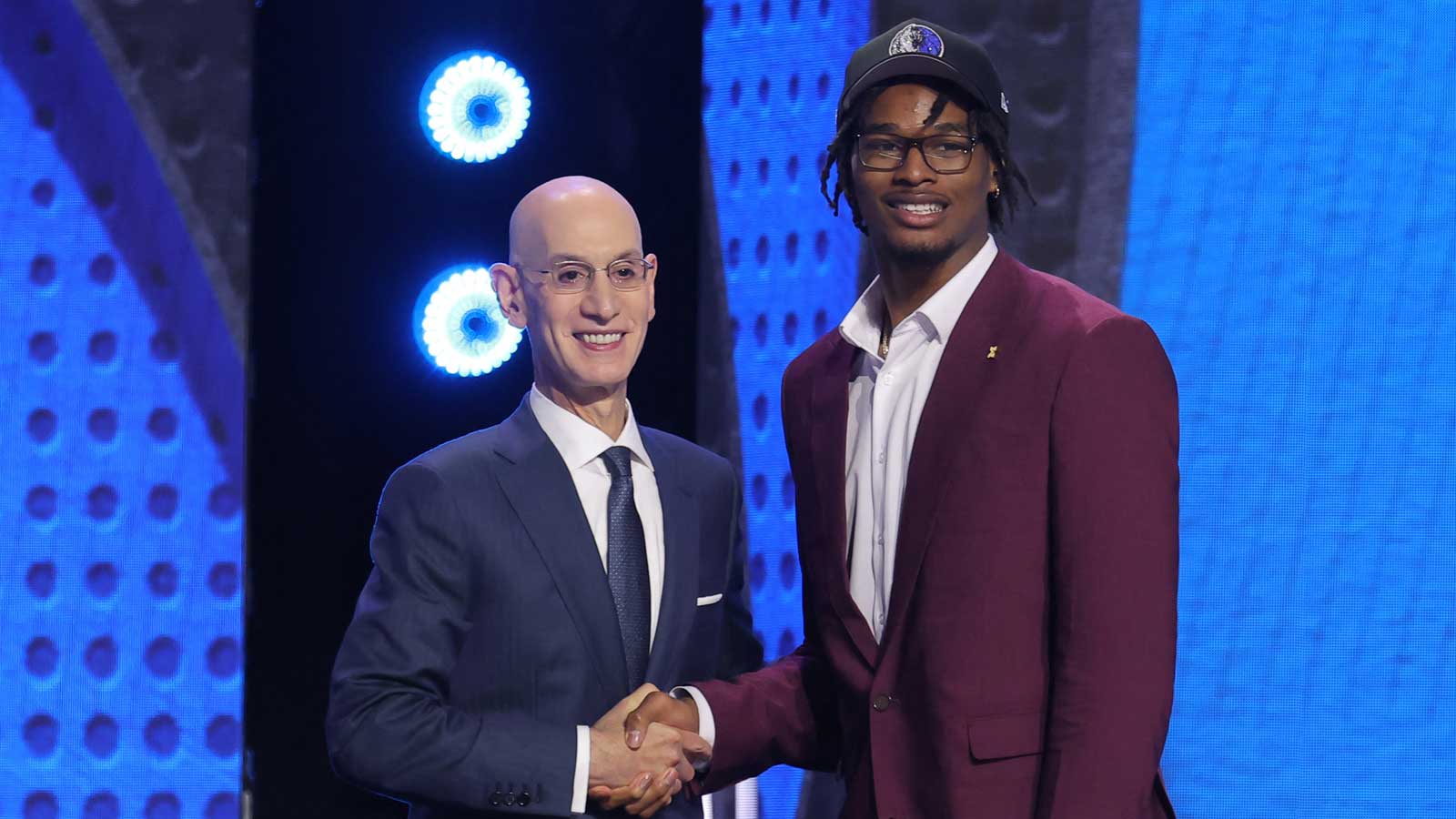 NBA commissioner Adam Silver greets the ninth pick in the 2026 NBA draft, Michigan forward Morez Johnson Jr. after he was selected by the Dallas Mavericks at Barclays Center. 