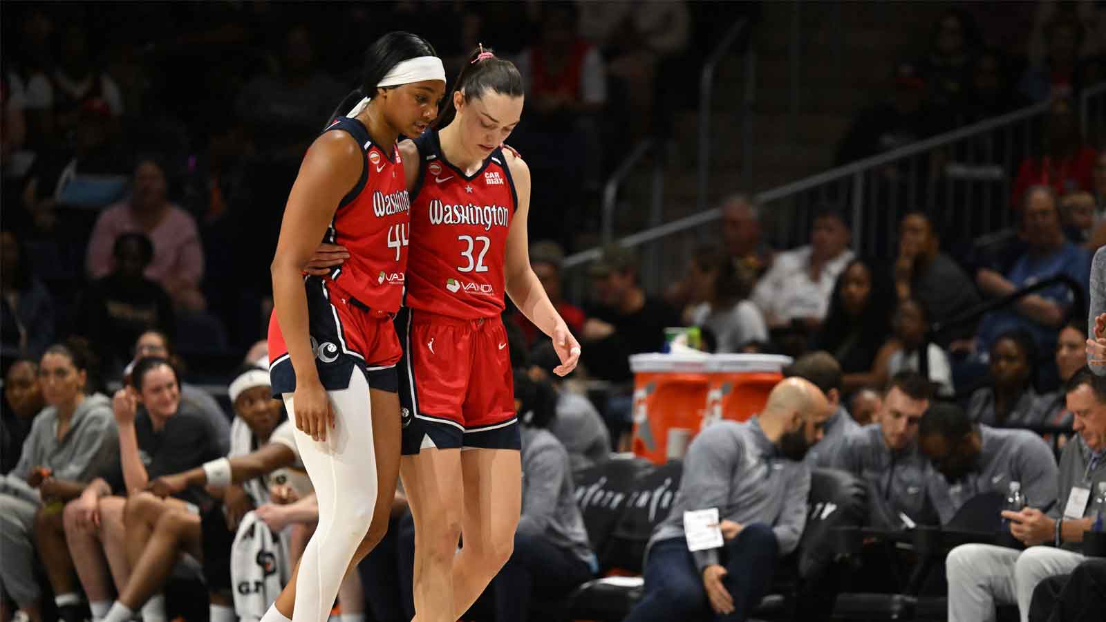 Washington Mystics forward Kiki Iriafen (44) is helped off the court by forward Angela Dugalic (32) against the Indiana Fever during the second quarter at CareFirst Arena.