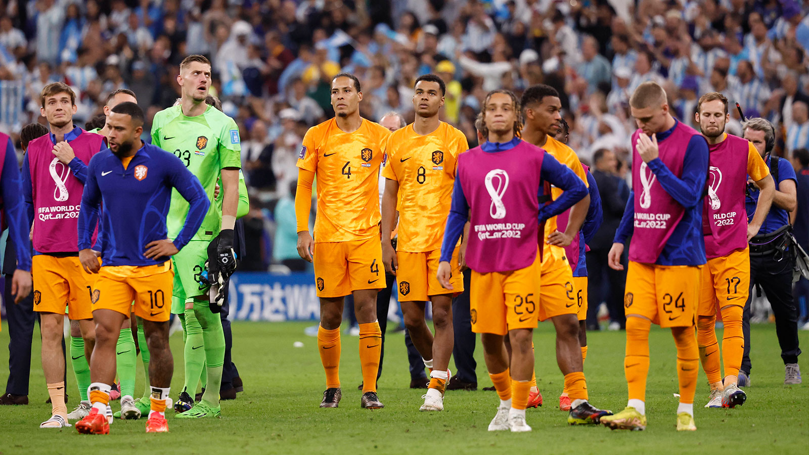 Netherlands players react after losing to Argentina in the quarterfinals of the 2022 FIFA World Cup at Lusail Stadium. 