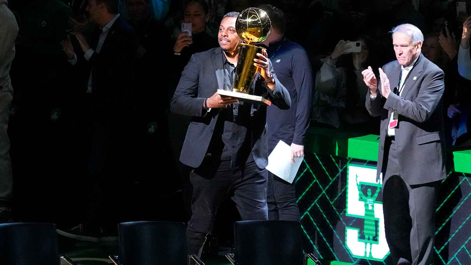 Former Boston Celtic Paul Pierce is introduced during Basketball Hall of Famer and former Boston Celtic Kevin GarnettÕs number retirement ceremony with the 2008 NBA World Championship Trophy after game between the Boston Celtics and the Dallas Mavericks at TD Garden