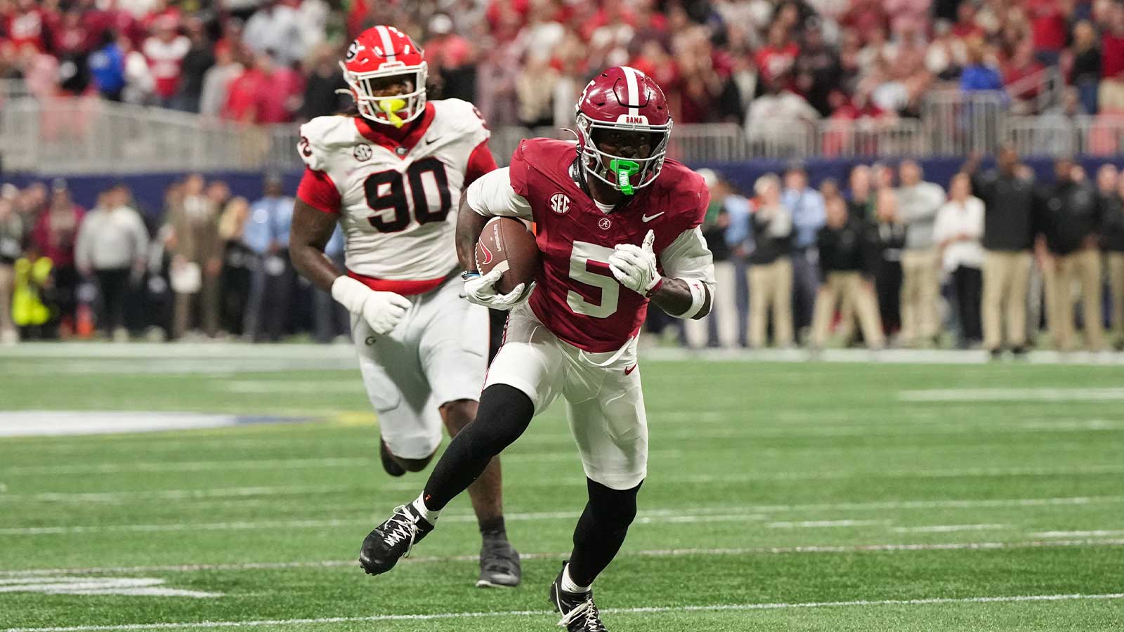Alabama Crimson Tide wide receiver Germie Bernard (5) runs after making a catch to score a touchdown during the fourth quarter against the Georgia Bulldogs during the 2025 SEC Championship game at Mercedes-Benz Stadium.