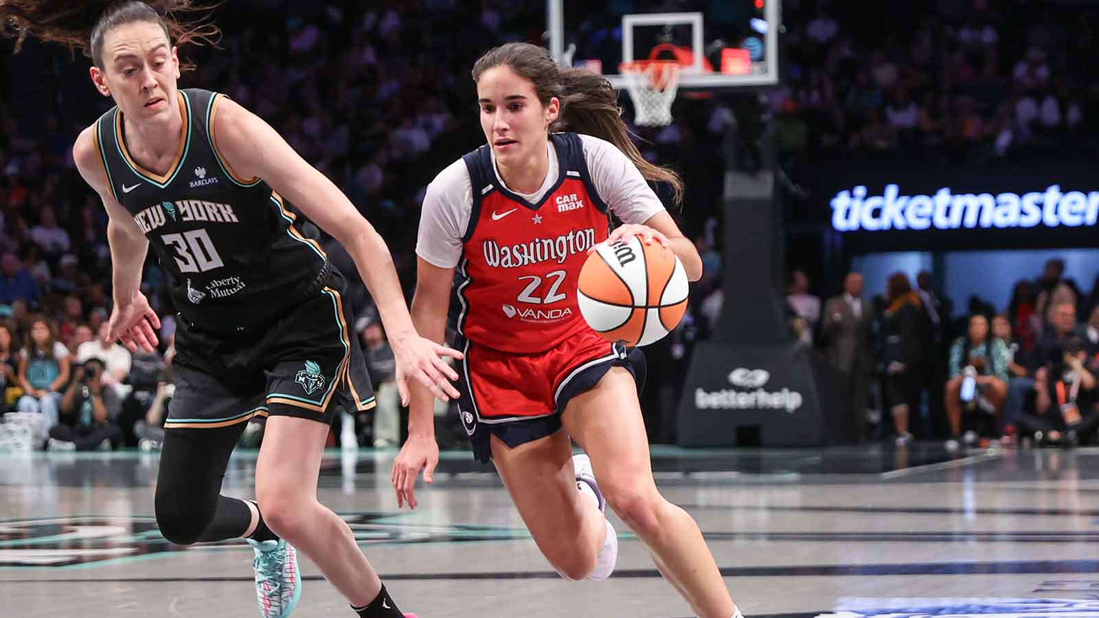 Washington Mystics guard Sonia Citron (22) drives past New York Liberty forward Breanna Stewart (30) in the second quarter at Barclays Center.