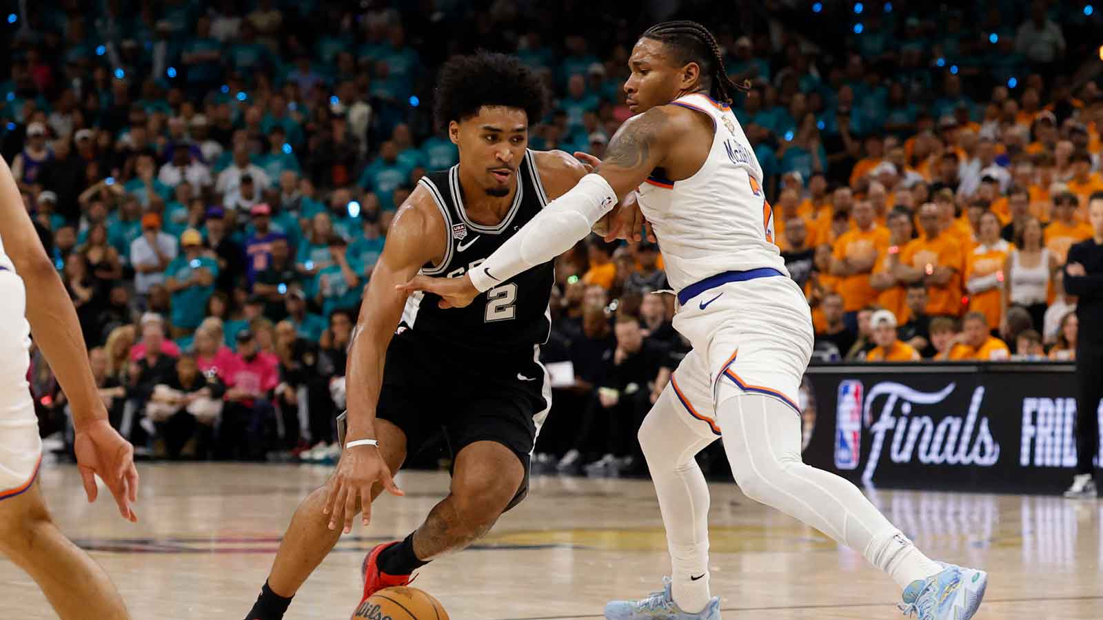 Spurs guard Dylan Harper (2) dribbles the ball vs. Knicks