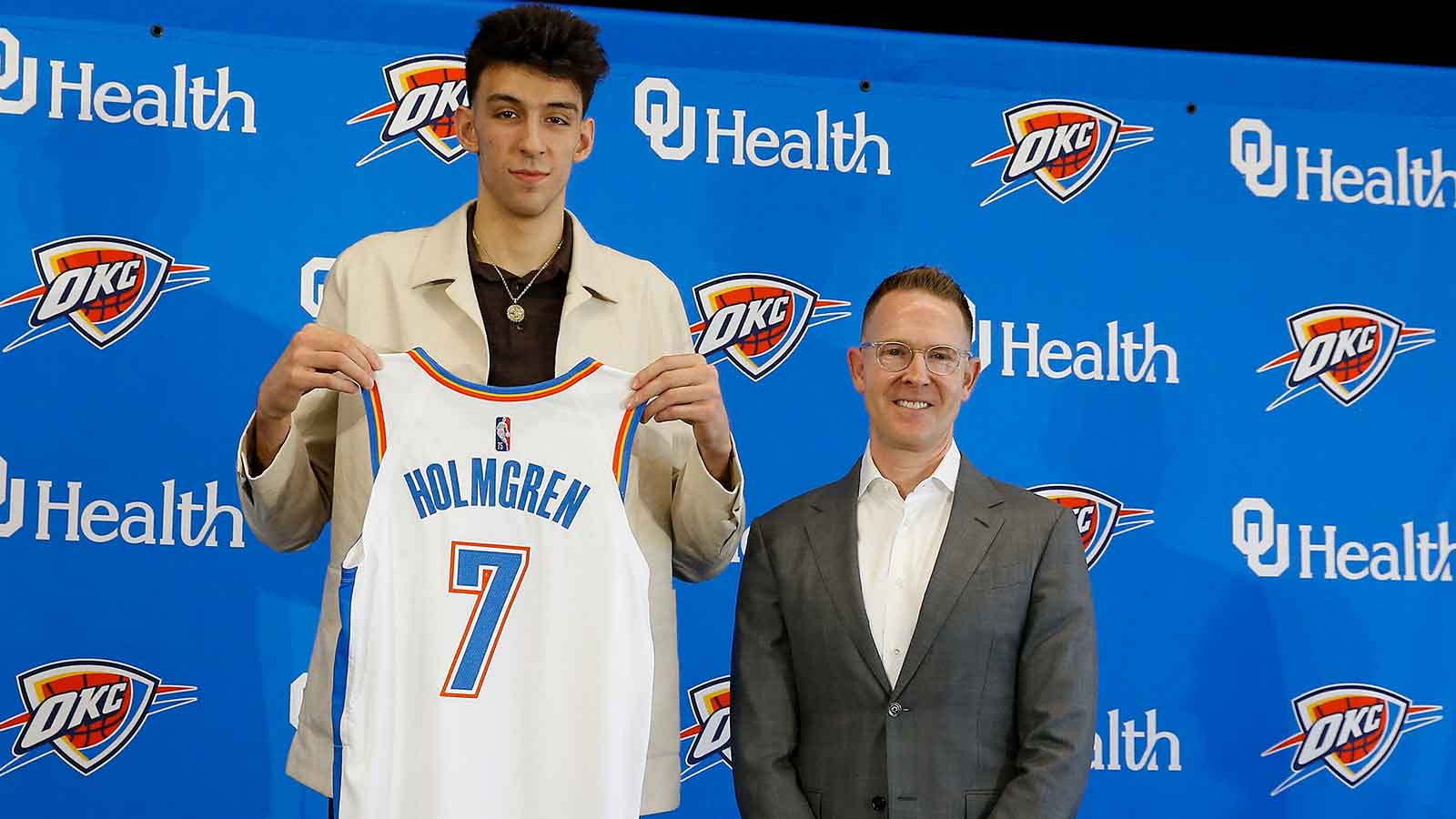 Thunder forward Chet Holmgren poses with his jersey and general manager Sam Presti following an introductory press conference at Clara Luper Center