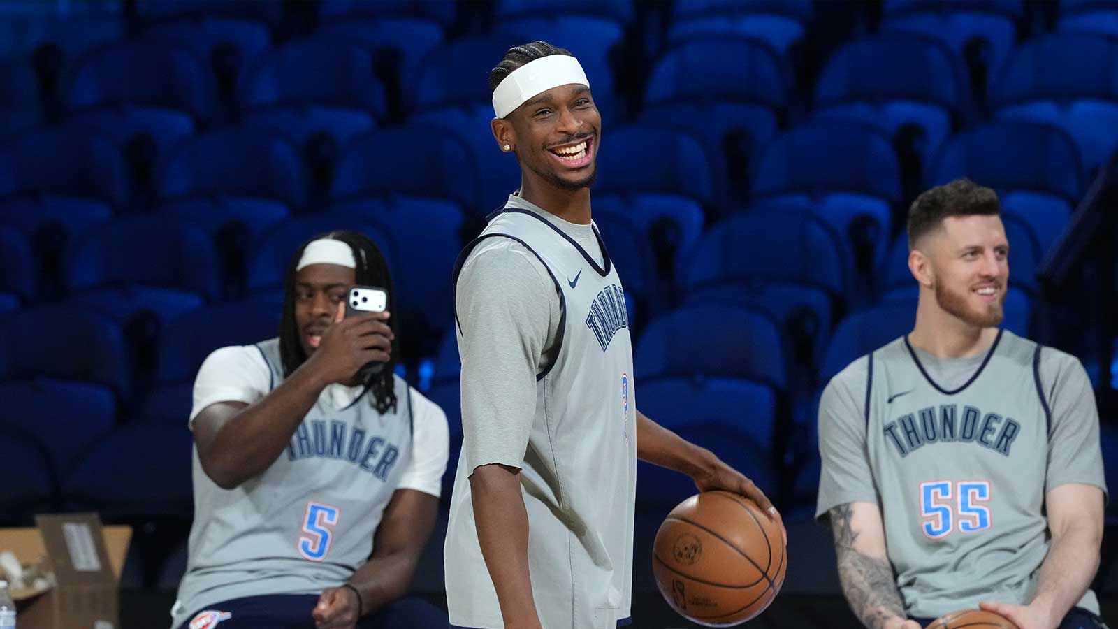 Thunder guard Luguentz Dort (5), guard Shai Gilgeous-Alexander (2) and center Isaiah Hartenstein (55) react during practice prior to the Emirates Cup semifinals at T-Mobile Arena