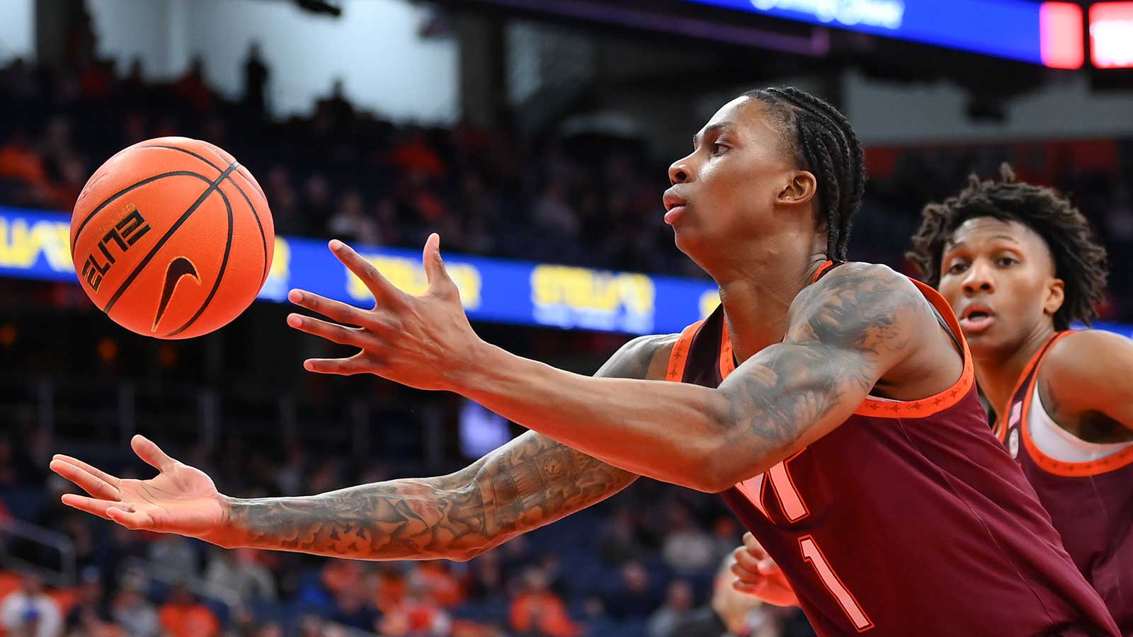 Virginia Tech Hokies forward Tobi Lawal (1) reaches for a loose ball during the second half against the Syracuse Orange at the JMA Wireless Dome. 