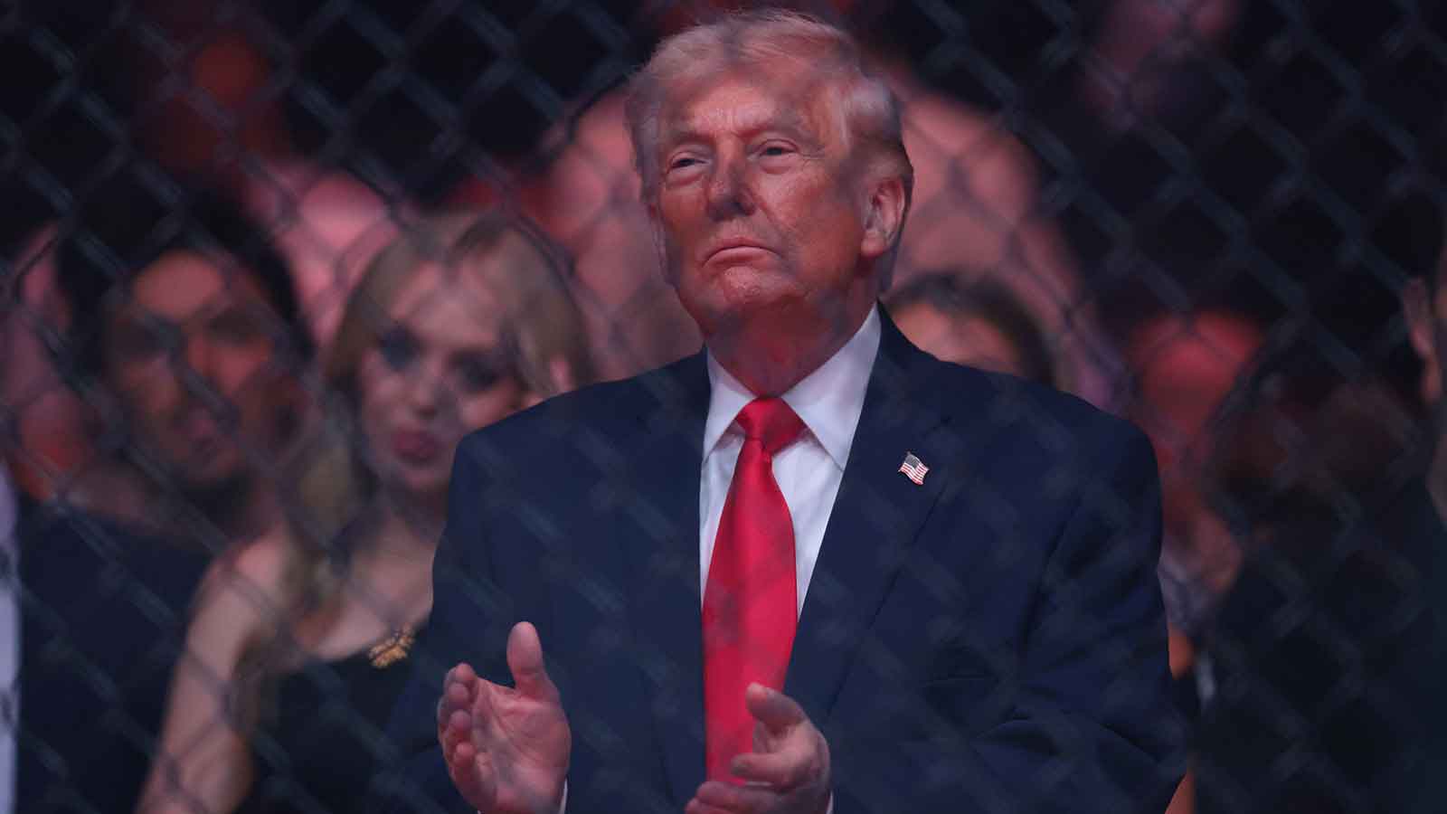 President of the United States Donald Trump reacts after the fight between Cub Swanson (red gloves) and Nate Landwehr (blue gloves) during UFC 327 at Kaseya Center.