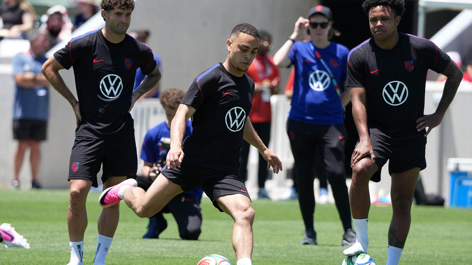 USMNT forward Christian Pulisic (left), defender Sergino Dest (center) and midfielder Weston McKennie during a community team training session in preparation for the 2026 FIFA World Cup at Great Park Championship Soccer Stadium.