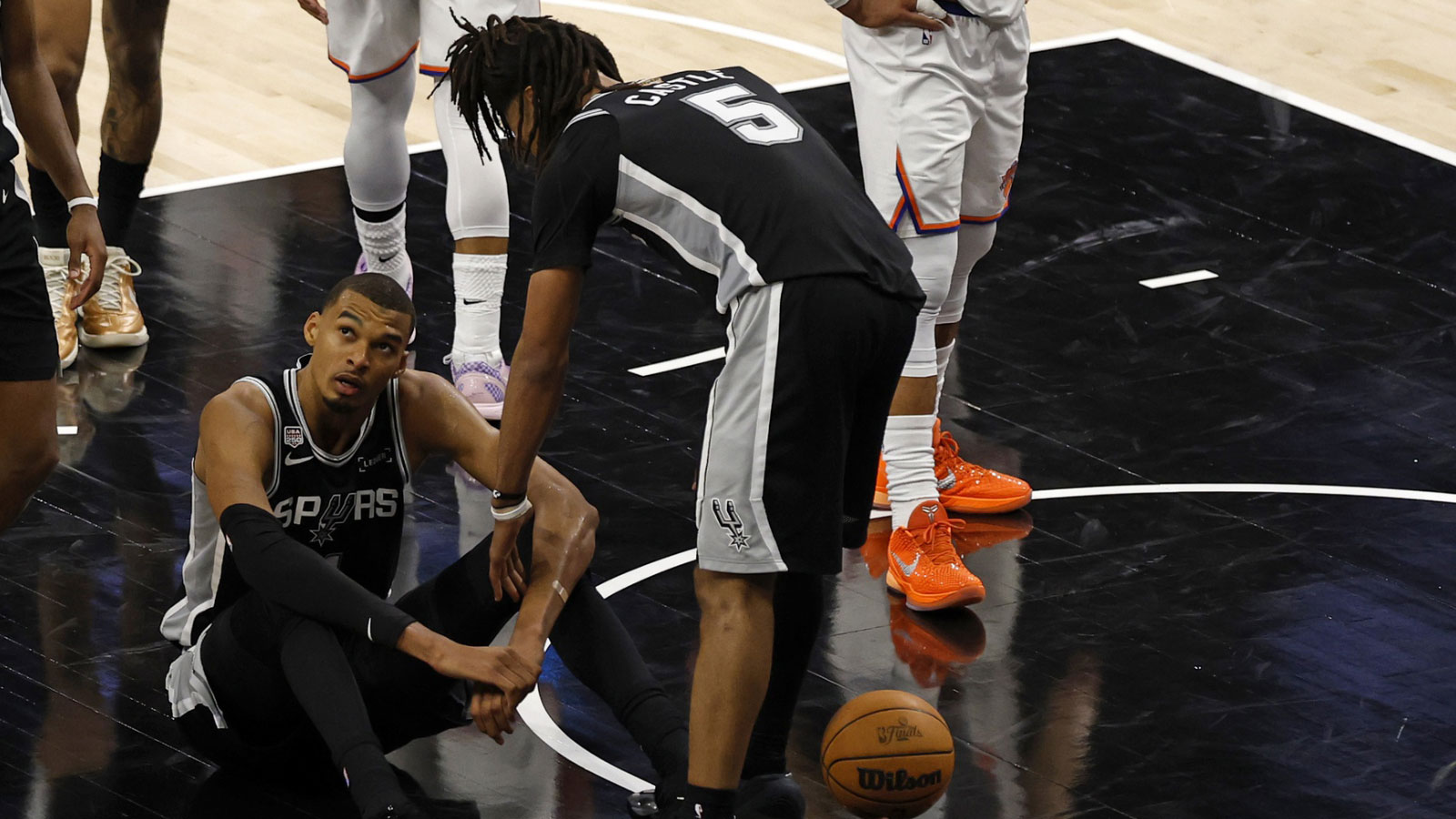 San Antonio Spurs forward Victor Wembanyama (1) reacts after a foul against the New York Knicks in the second half during game one of the 2026 NBA Finals at Frost Bank Center. 