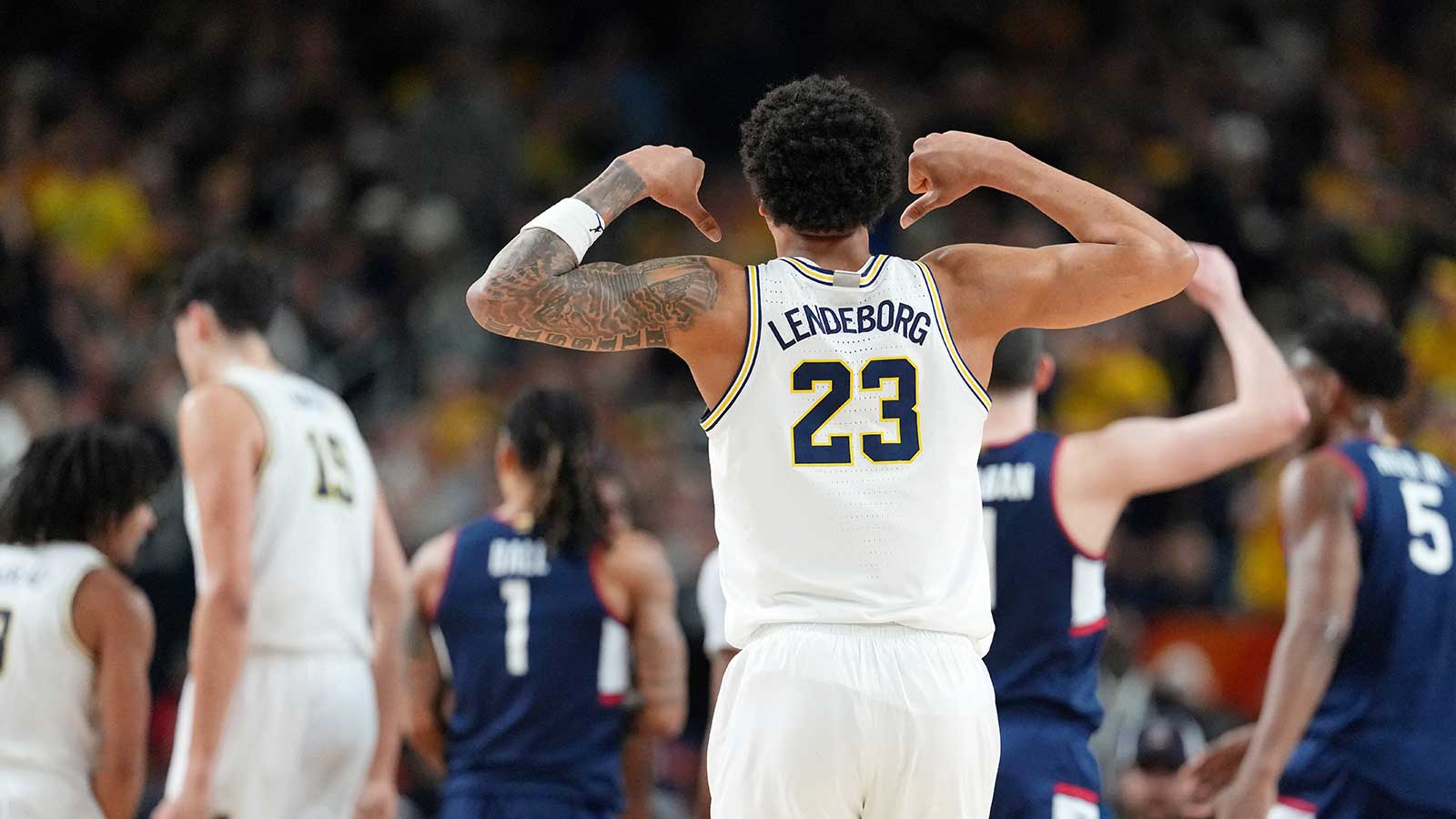 Michigan Wolverines forward Yaxel Lendeborg (23) reacts after a play against the UConn Huskies during the first half in the national championship of the Final Four of the men's 2026 NCAA Tournament between the and the Michigan Wolverines at Lucas Oil Stadium.