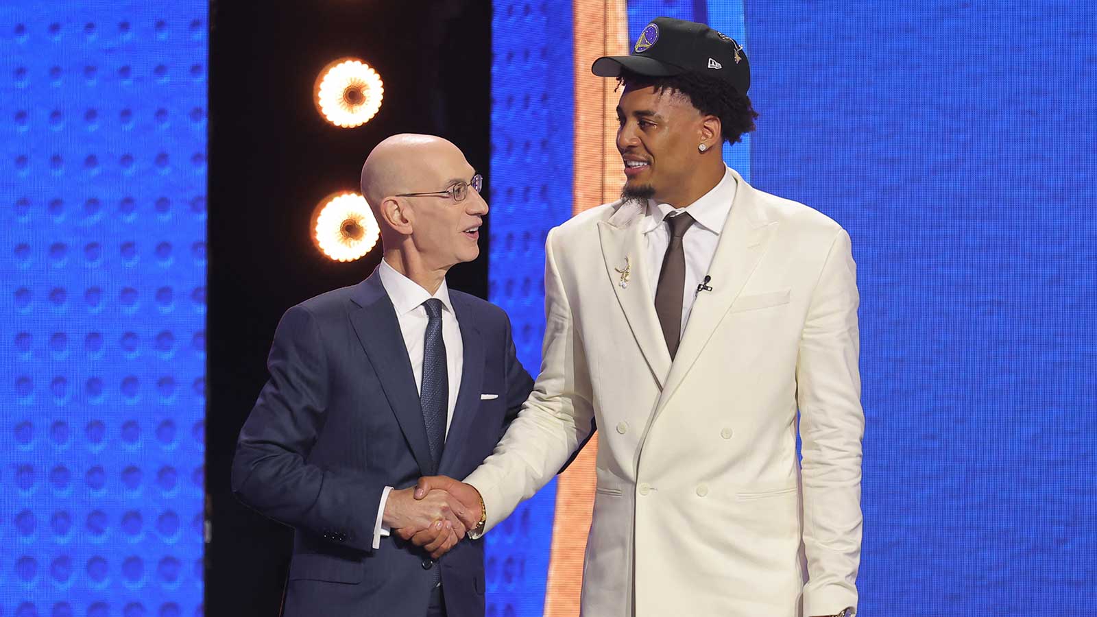 NBA commissioner Adam Silver greets the eleventh pick in the 2026 NBA draft, Michigan forward Yaxel Lendeborg after he was selected by the Golden State Warriors at Barclays Center.