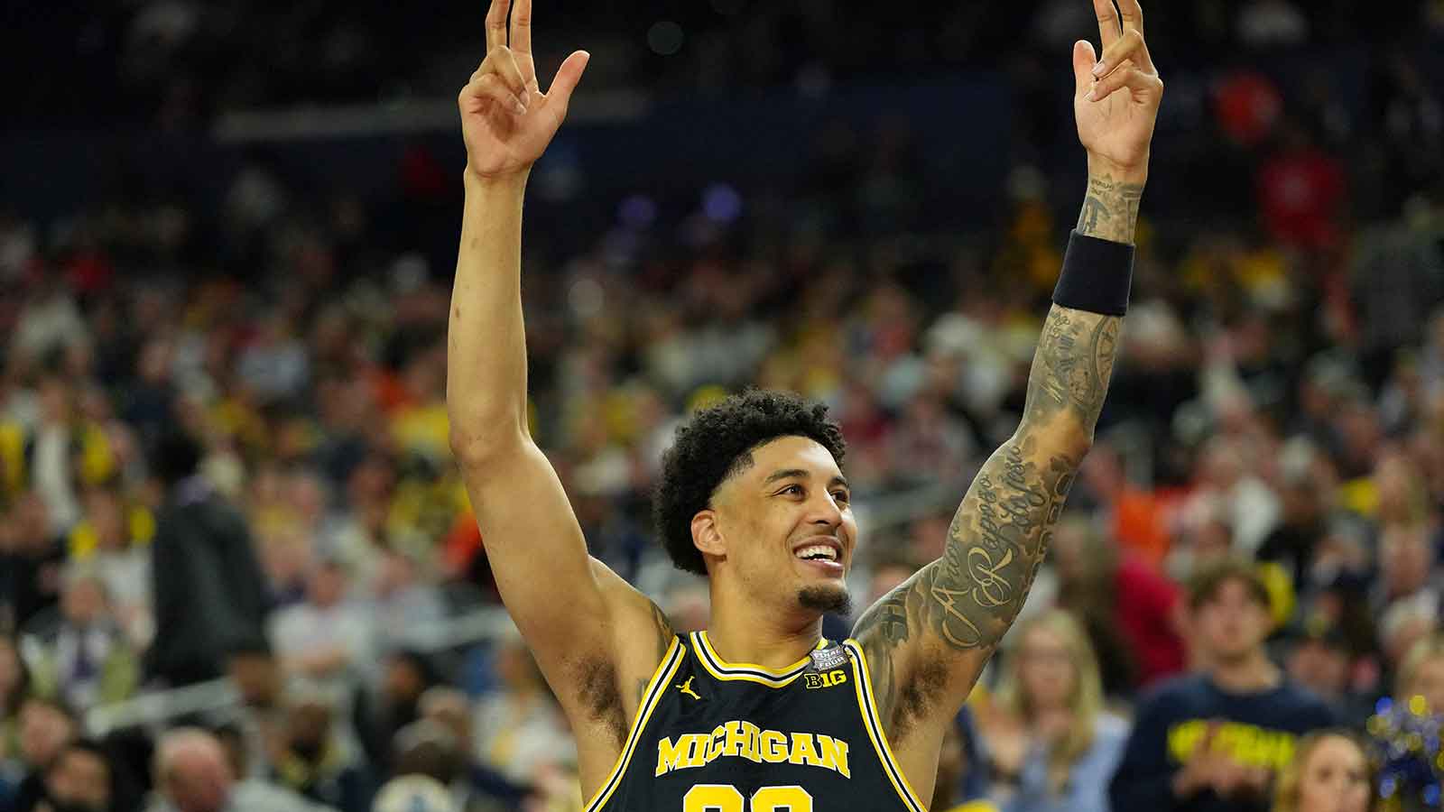 Michigan Wolverines forward Yaxel Lendeborg (23) celebrates against the Arizona Wildcats in a semifinal of the Final Four of the men's 2026 NCAA Tournament at Lucas Oil Stadium.