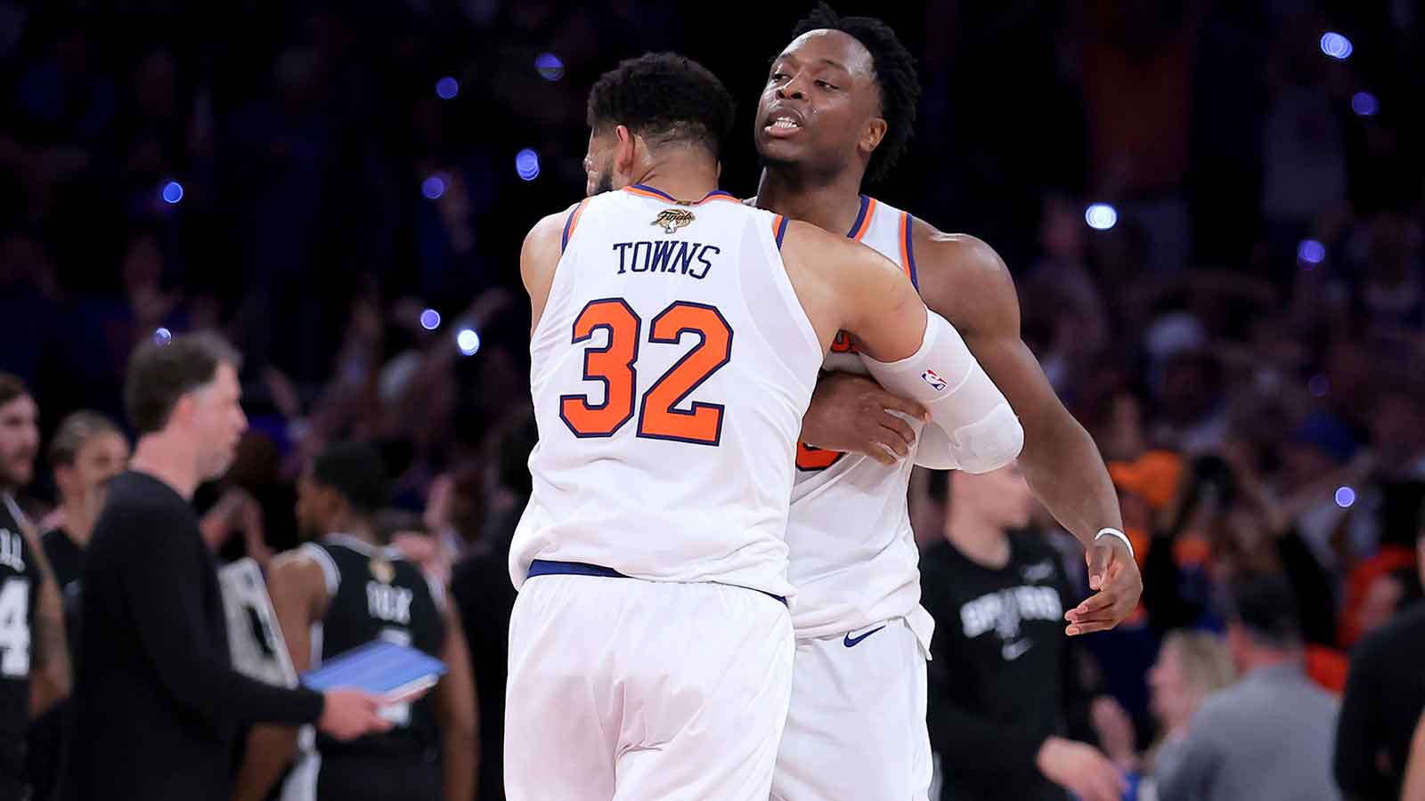 New York Knicks center Karl-Anthony Towns (32) hugs forward OG Anunoby (8) after Anunoby's go ahead basket late during the fourth quarter of game four of the 2026 NBA Finals against the San Antonio Spurs at Madison Square Garden.