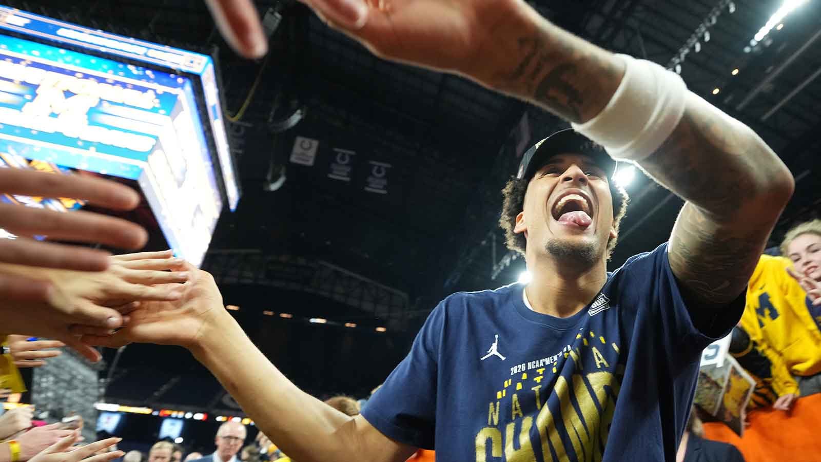 Michigan Wolverines forward Yaxel Lendeborg (23) with fans after the National Championship of the Final Four of the men's 2026 NCAA Tournament at Lucas Oil Stadium.