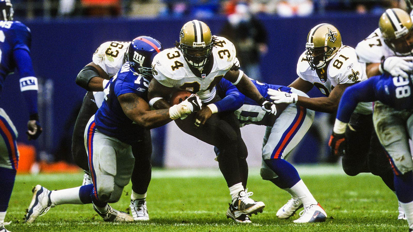 FILE PHOTO; New Orleans Saints running back Ricky Williams (34) in action against New York Giants defensive players Kenny Holmes (90) and Keith Hamilton (75) at Giants Stadium.