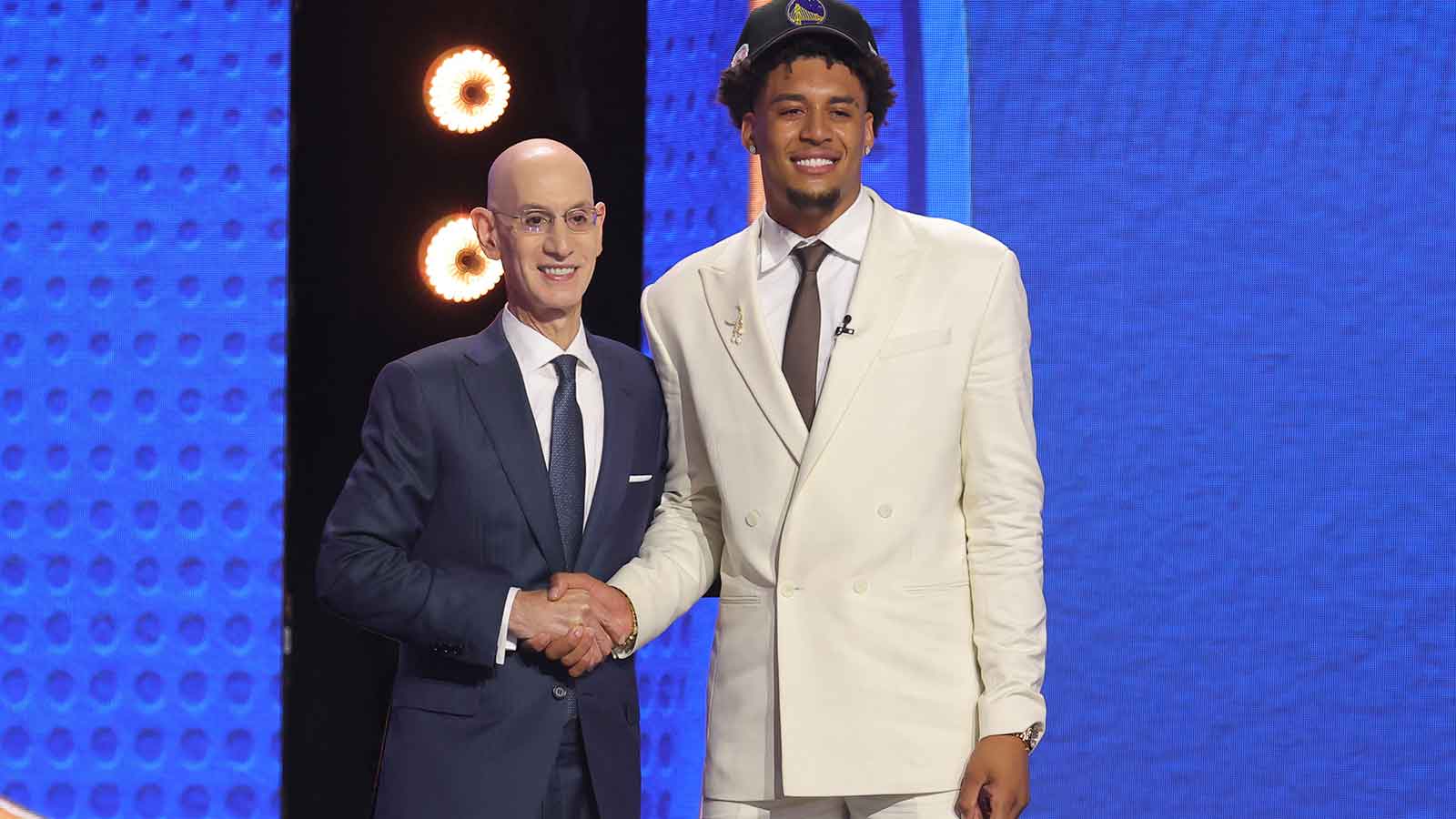 NBA commissioner Adam Silver greets the eleventh pick in the 2026 NBA draft, Michigan forward Yaxel Lendeborg after he was selected by the Golden State Warriors at Barclays Center.