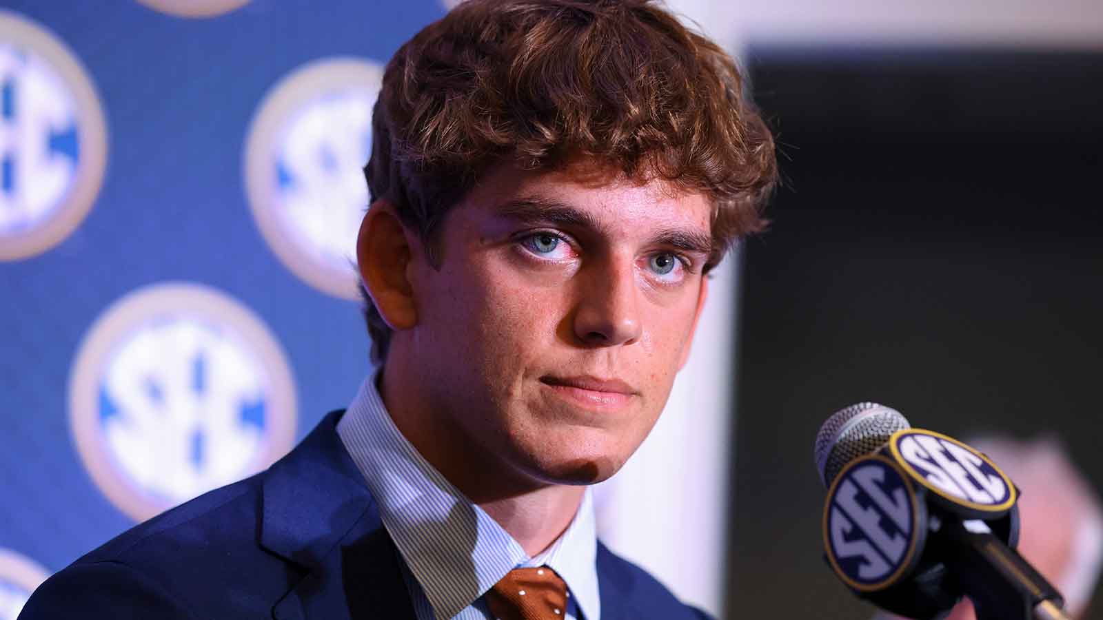 Texas Longhorns quarterback Arch Manning (16) speaks to the press during SEC Football Kickoff Media Day at the Tampa Marriott.