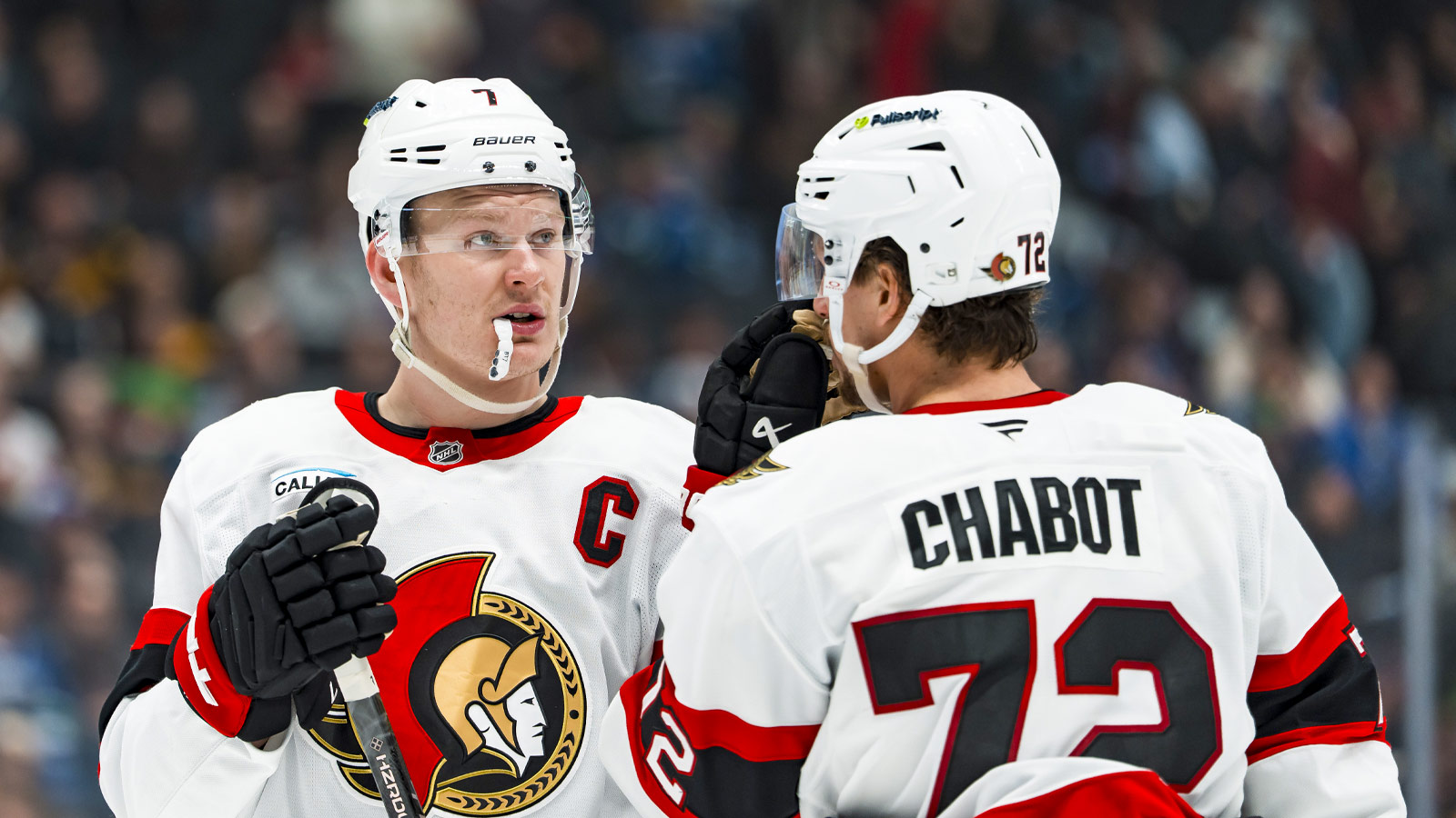https://wp.clutchpoints.com/wp-content/uploads/2026/07/Brady-Tkachuk-talking-to-a-teammate.jpg