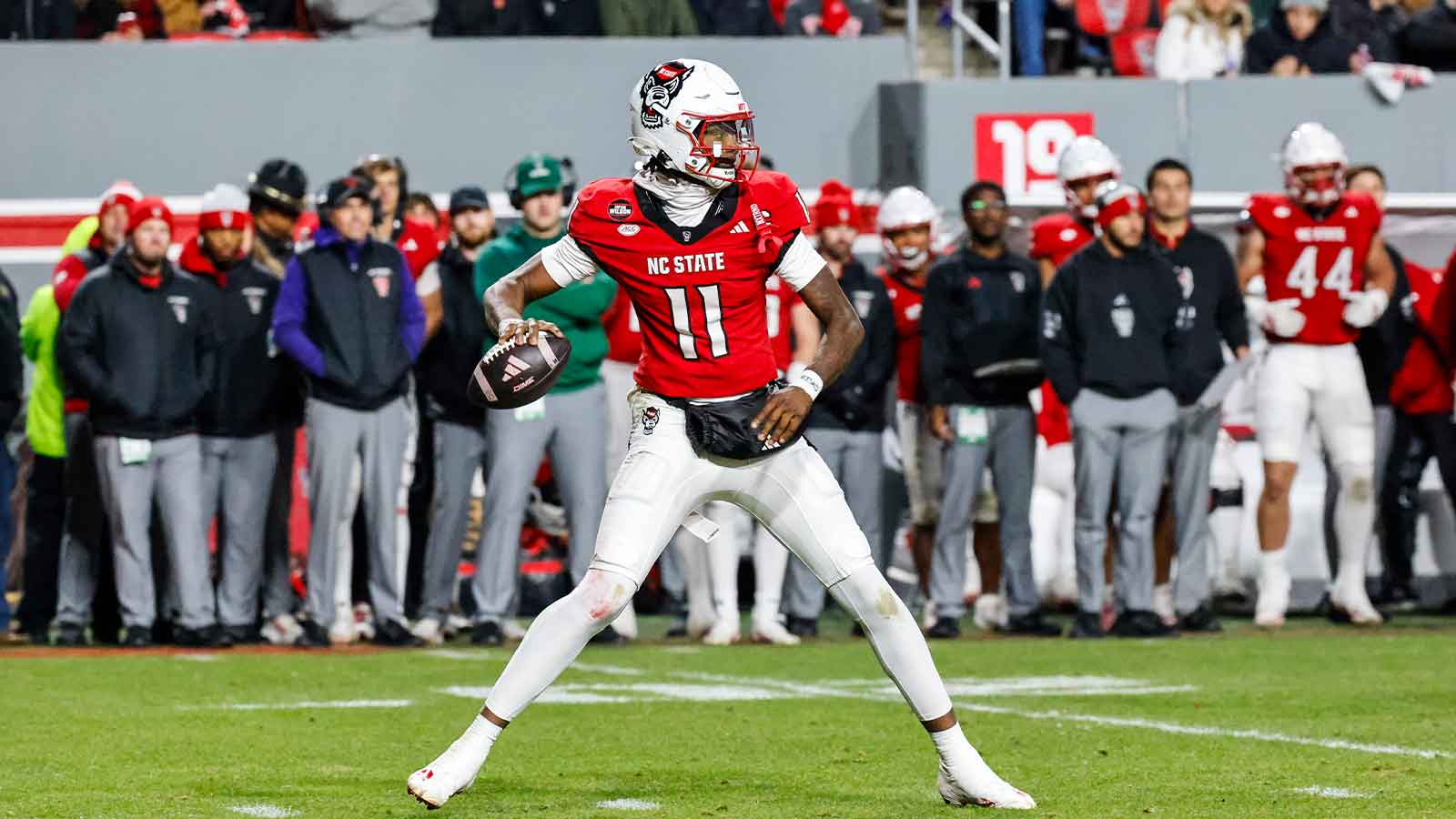NC State Wolfpack quarterback CJ Bailey (11) prepares to throw the football during the first half of the game against North Carolina Tar Heels at Carter-Finley Stadium.