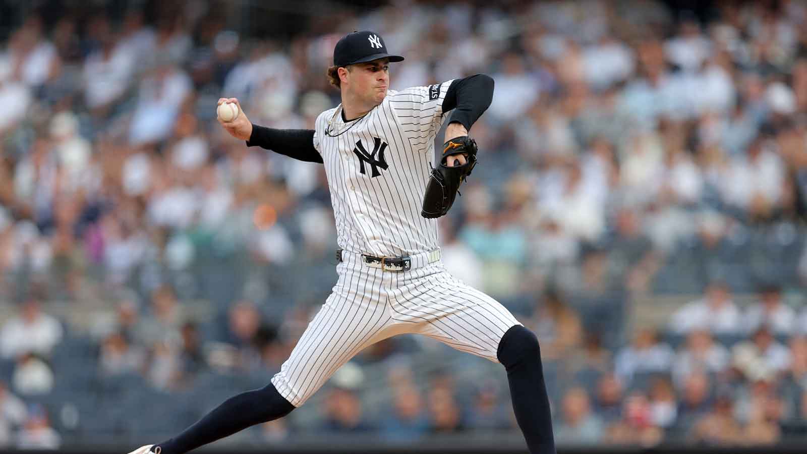 New York Yankees starting pitcher Cam Schlittler (31) pitches against the Detroit Tigers during the first inning at Yankee Stadium.