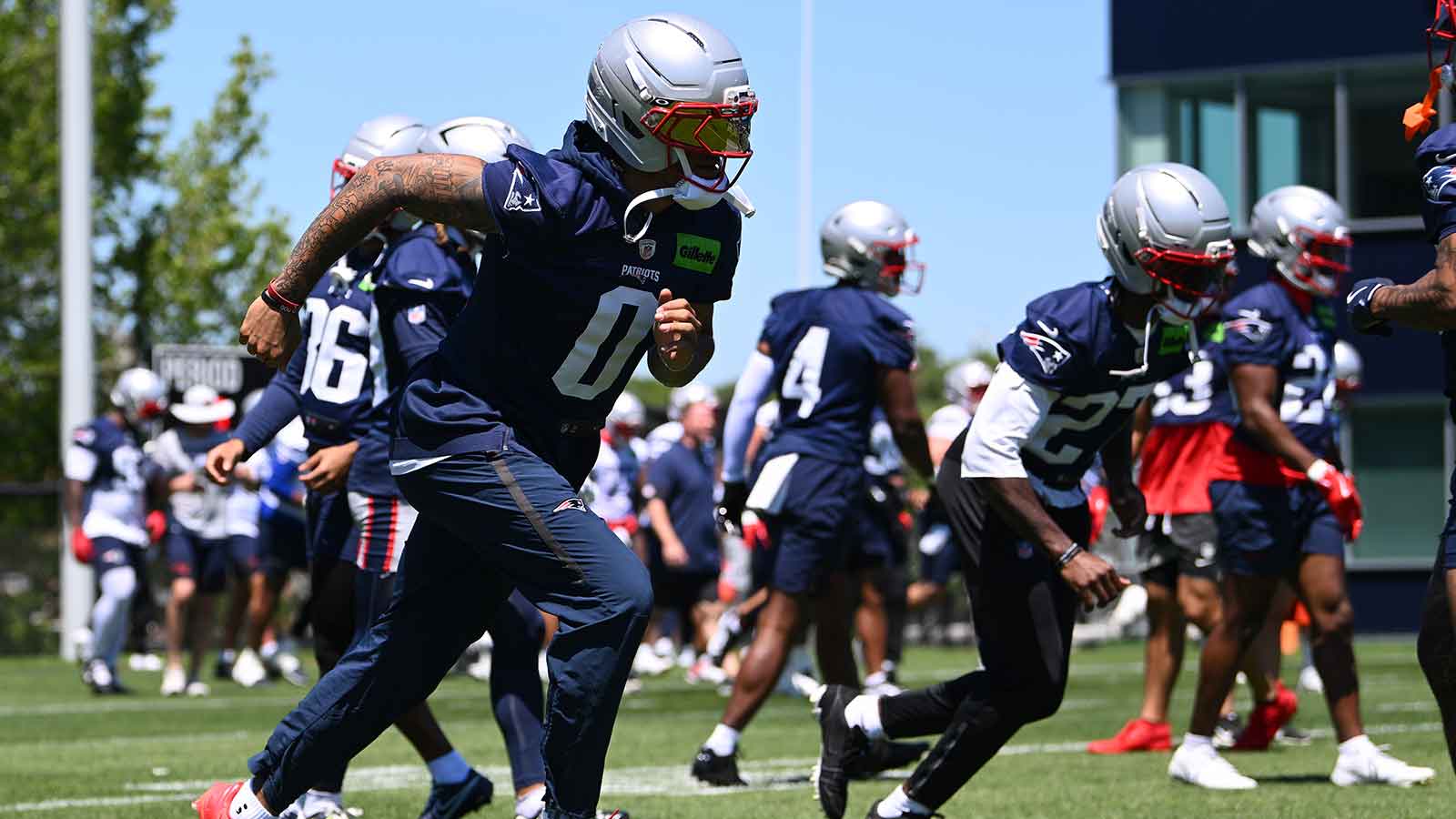 https://wp.clutchpoints.com/wp-content/uploads/2026/07/England-Patriots-cornerback-Christian-Gonzalez-warms-up.jpg