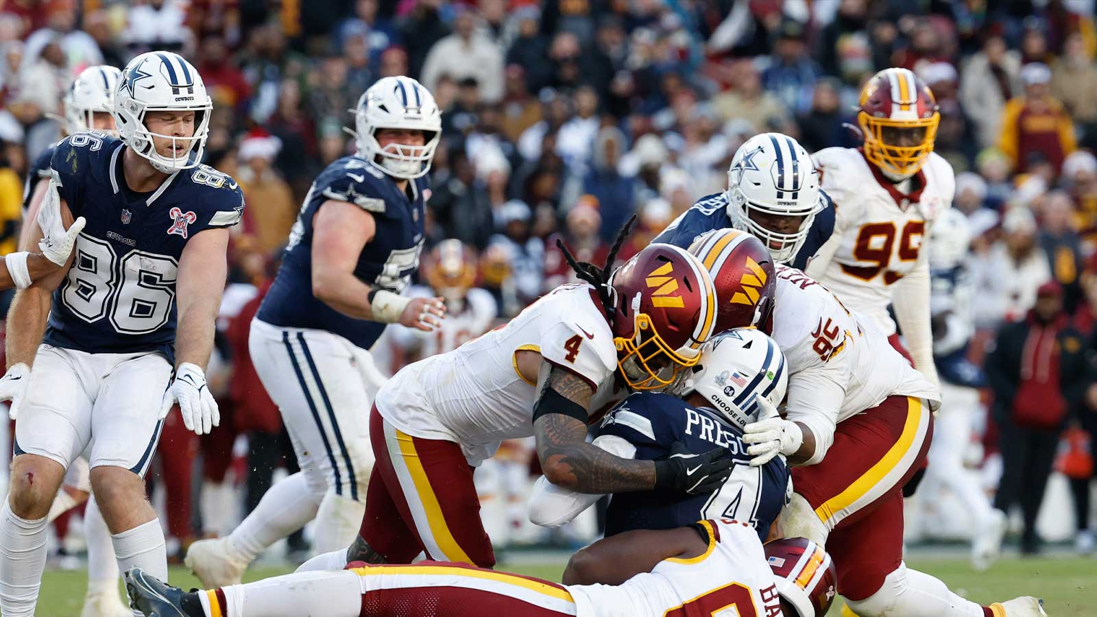 https://wp.clutchpoints.com/wp-content/uploads/2026/07/Frankie-Luvu-Ricky-Barber-and-JerZhan-Newton-tackle-Dak-Prescott.jpg