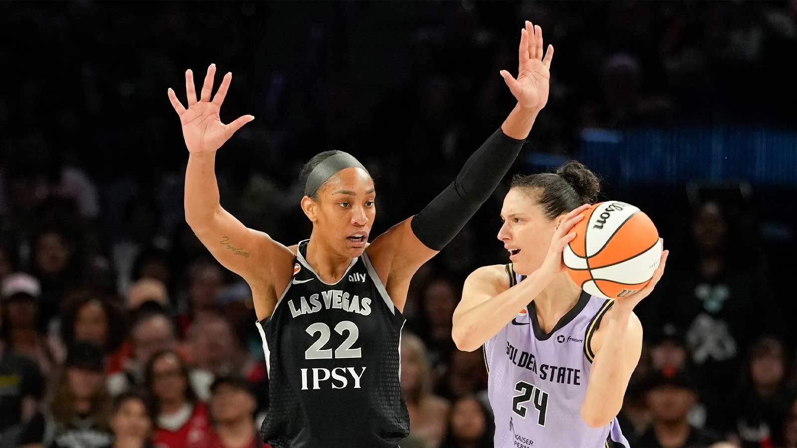 Golden State Valkyries forward Cecilia Zandalasini (24) controls the ball against Las Vegas Aces center A'ja Wilson (22) during the second quarter of a WNBA basketball game at Michelob Ultra Arena.
