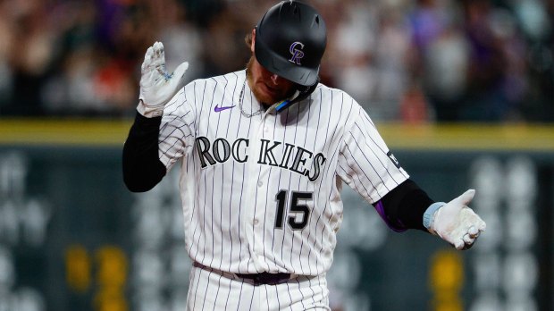 Colorado Rockies catcher Hunter Goodman (15) gestures as he rounds the bases on a solo home run in the eighth inning against the Washington Nationals at Coors Field.
