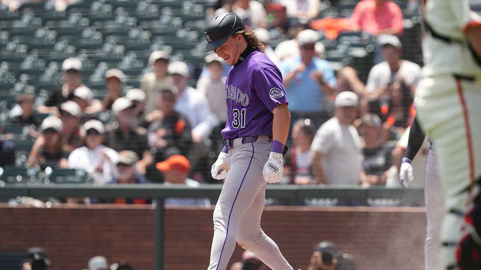 Colorado Rockies right fielder Jake McCarthy (31) retouches home plate after hitting an inside the park home run against the San Francisco Giants during the first inning at Oracle Park.