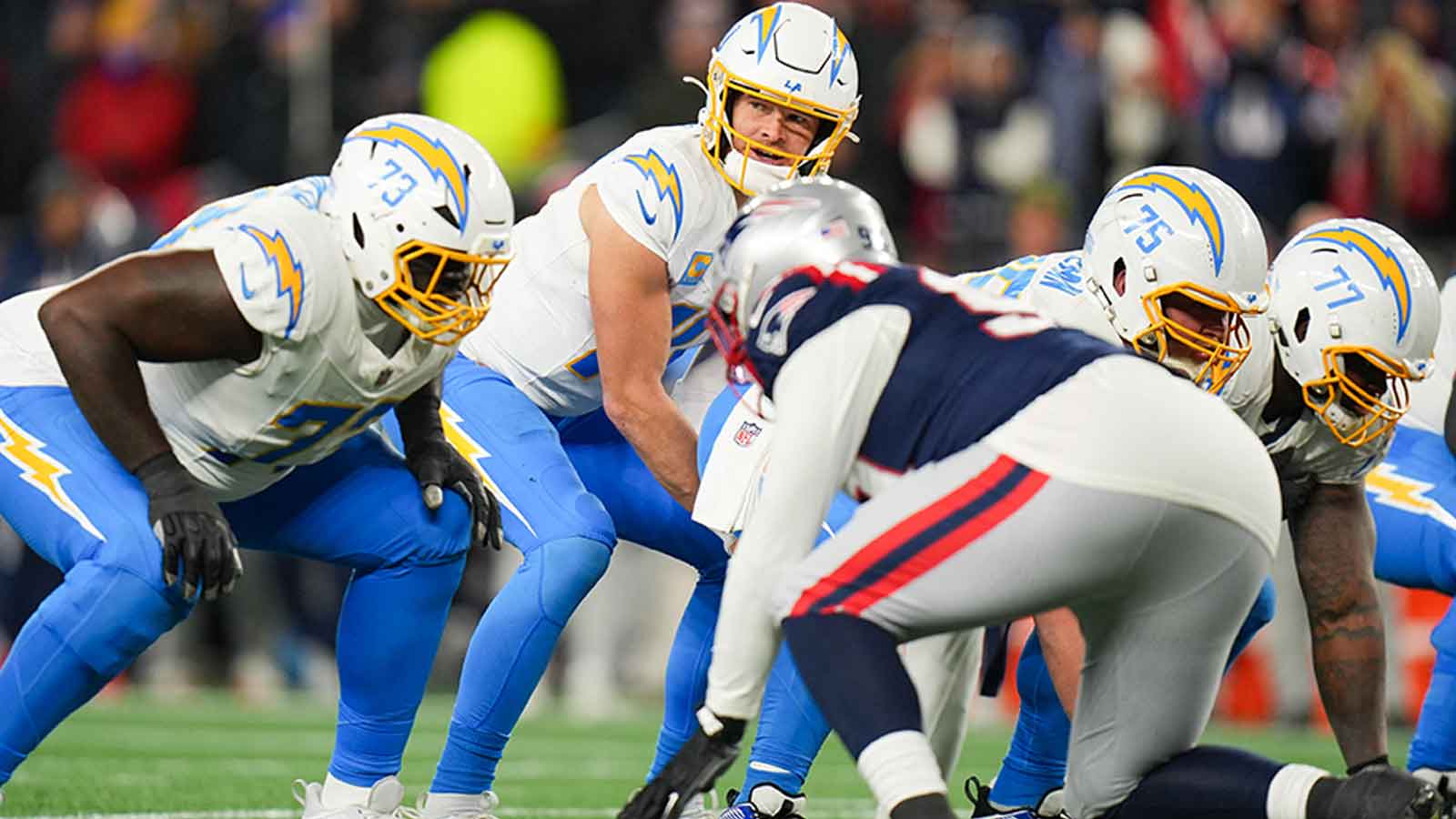 Los Angeles Chargers quarterback Justin Herbert (10) calls a play during the second quarter against the New England Patriots in an AFC Wild Card Round game at Gillette Stadium.
