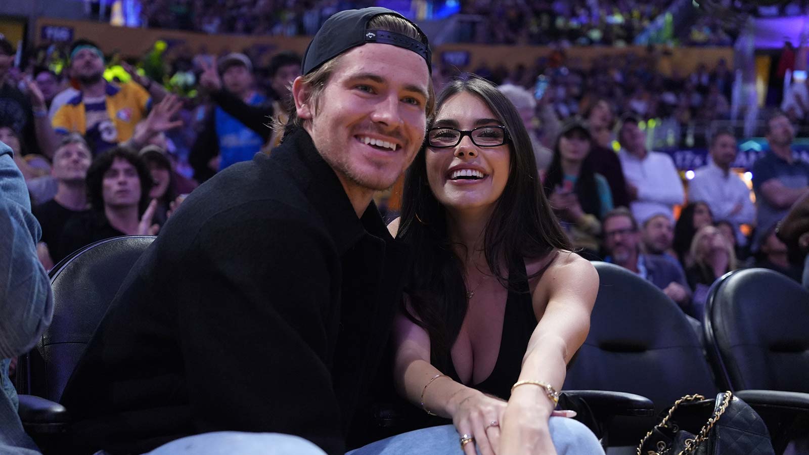 Los Angeles Chargers quarterback Justin Herbert (left) and girlfriend Madison Beer attend the game between the Minnesota Timberwolves and the Los Angeles Lakers at Crypto.com Arena.