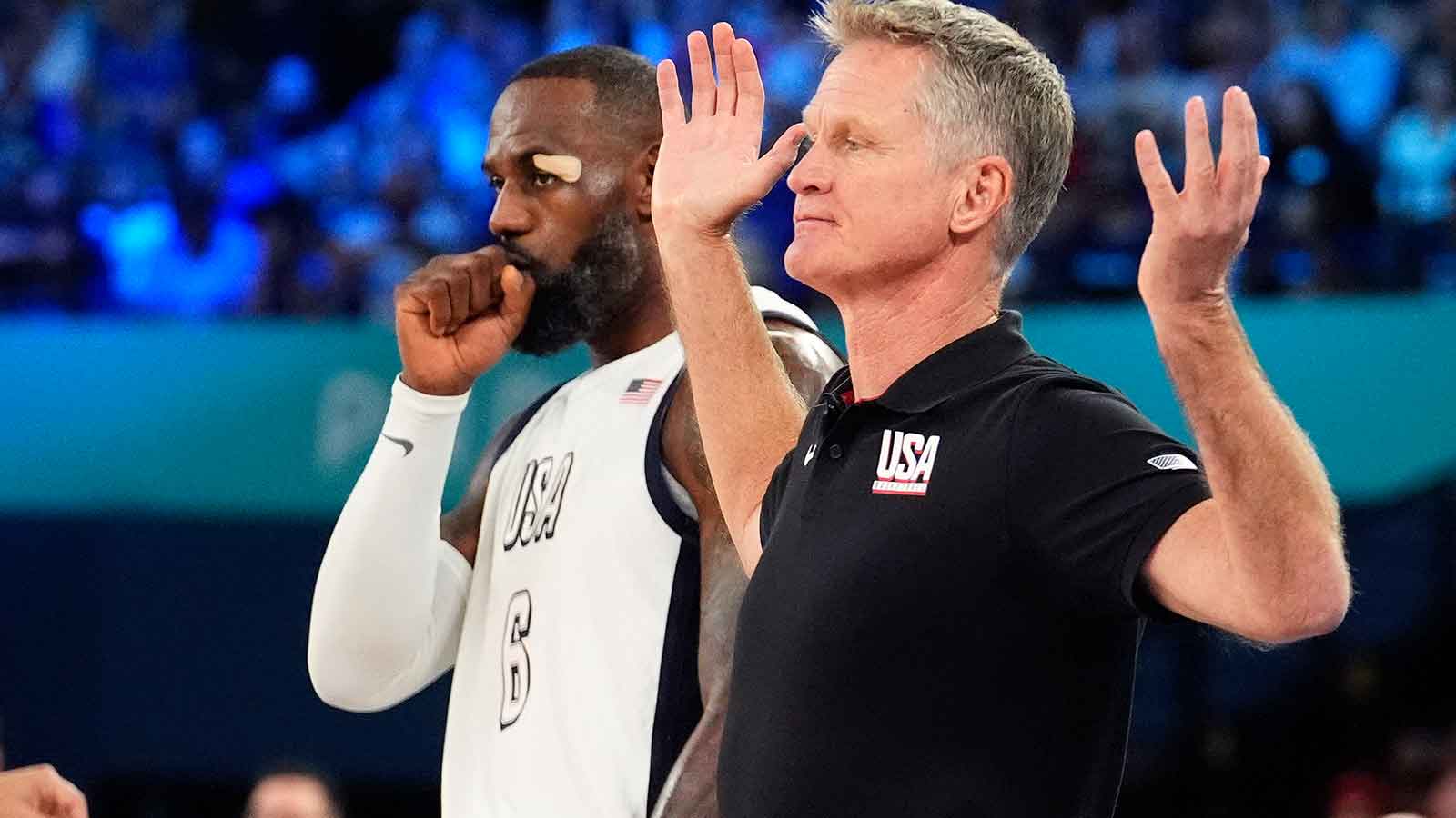 United States head coach Steve Kerr reacts alongside guard LeBron James (6) during the first half against Serbia in a men's basketball semifinal game during the Paris 2024 Olympic Summer Games at Accor Arena.