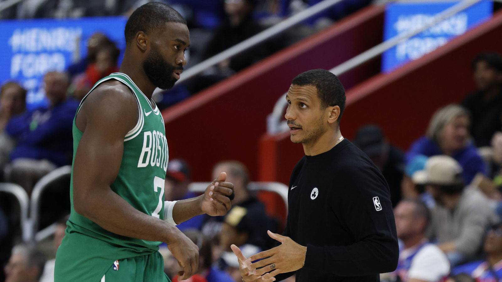 Boston Celtics head coach Joe Mazzulla talks to guard Jaylen Brown (7) in the second half against the Detroit Pistons at Little Caesars Arena.
