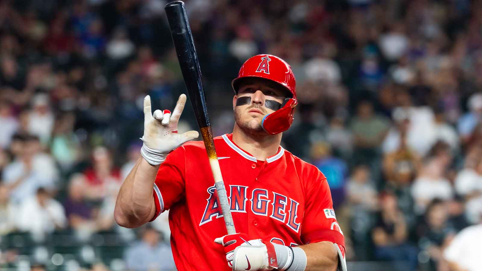 Los Angeles Angels outfielder Mike Trout gestures to a fan against the Arizona Diamondbacks in the first inning at Chase Field.