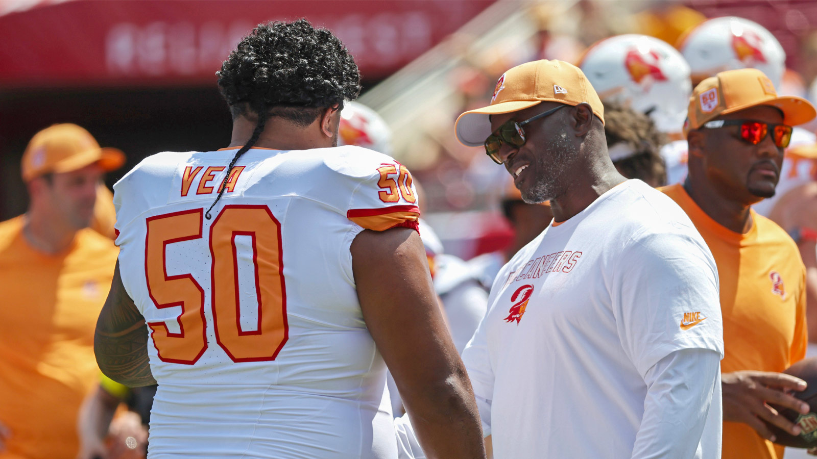 Tampa Bay Buccaneers head coach Todd Bowles and defensive tackle Vita Vea (50) talk prior to the game at Raymond James Stadium.