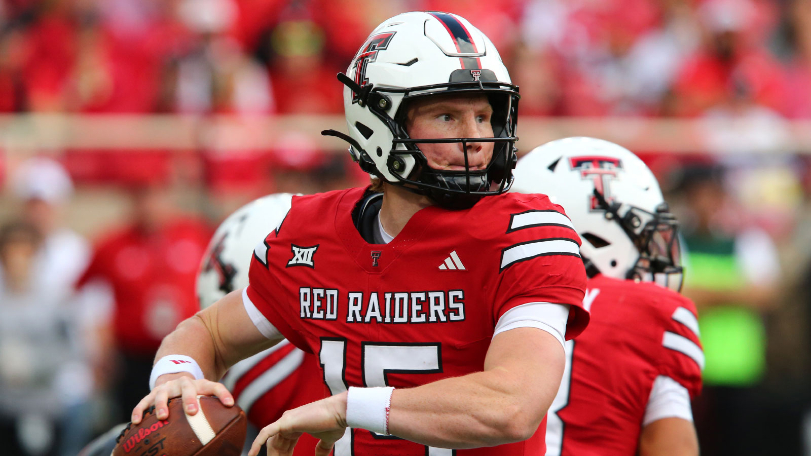 Texas Tech Red Raiders quarterback Will Hammond (15) passes against the Oklahoma State Cowboys in the first half at Jones AT&T Stadium.