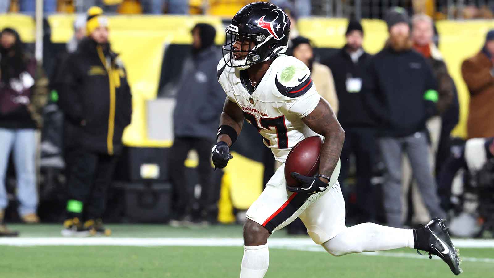 Houston Texans running back Woody Marks (27) scores a touchdown during the second half of an AFC Wild Card Round game against the Pittsburgh Steelers at Acrisure Stadium.