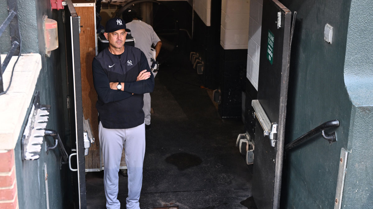 https://wp.clutchpoints.com/wp-content/uploads/2026/08/Aaron-Boone-watches-from-the-clubhouse_acd633.jpg