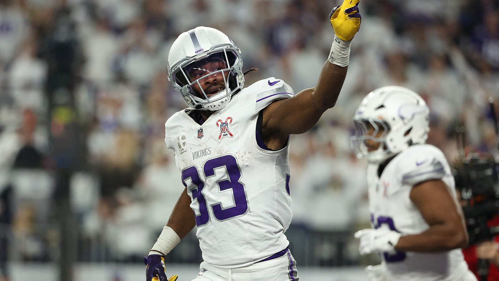 Minnesota Vikings running back Aaron Jones Sr. (33) celebrates after scoring a touchdown against the Detroit Lions in the first quarter at U.S. Bank Stadium. 
