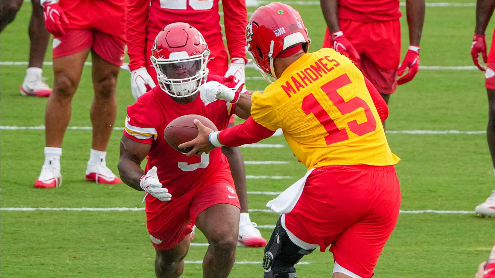 Kansas City Chiefs quarterback Patrick Mahomes (15) hands off to running back Kenneth Walker (9) during training camp at Missouri Western State University.