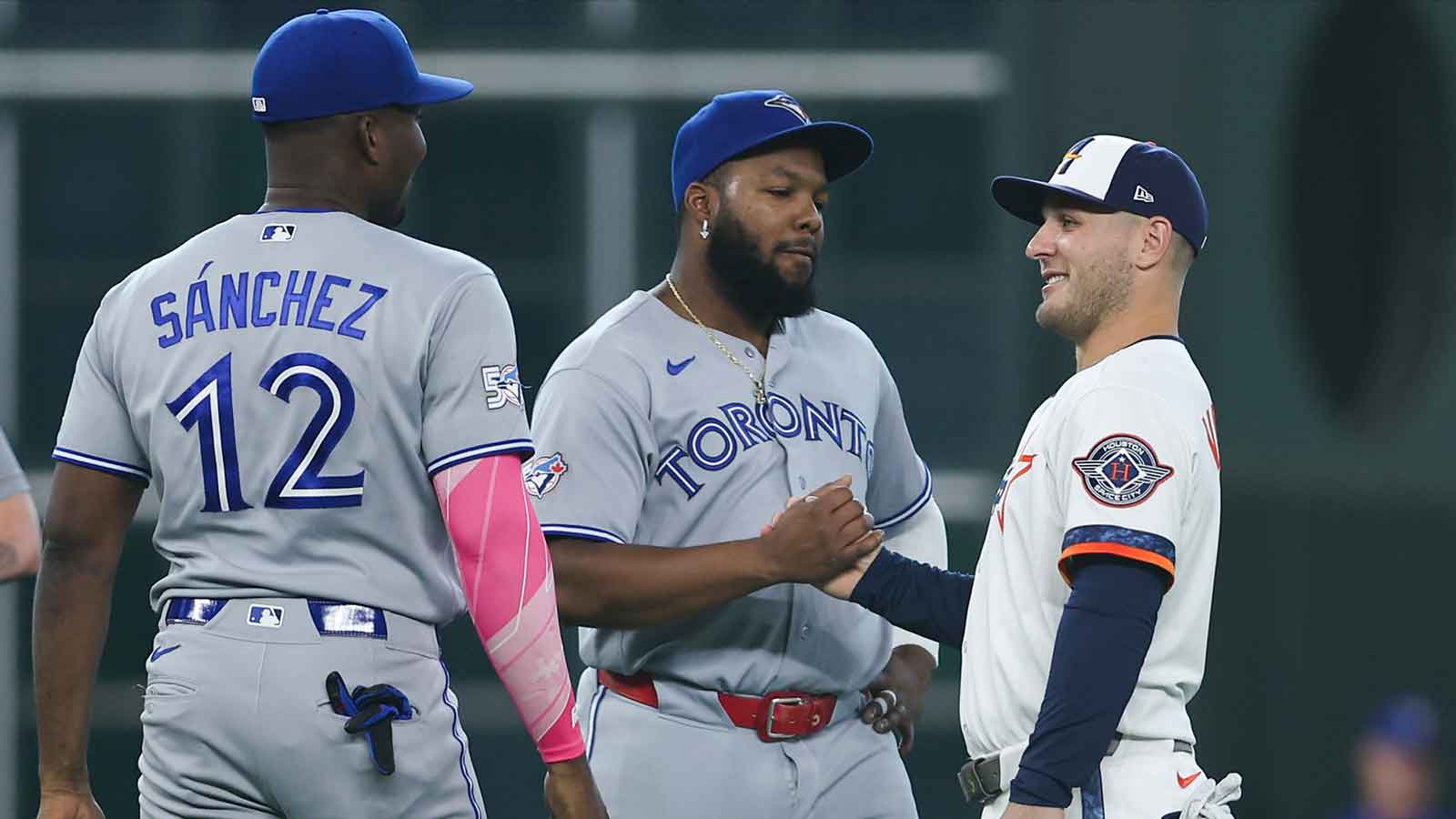 https://wp.clutchpoints.com/wp-content/uploads/2026/08/Astros-CF-Daulton-Varsho-18-greets-Blue-Jays-1B-Vladimir-Guerrero-Jr.jpg