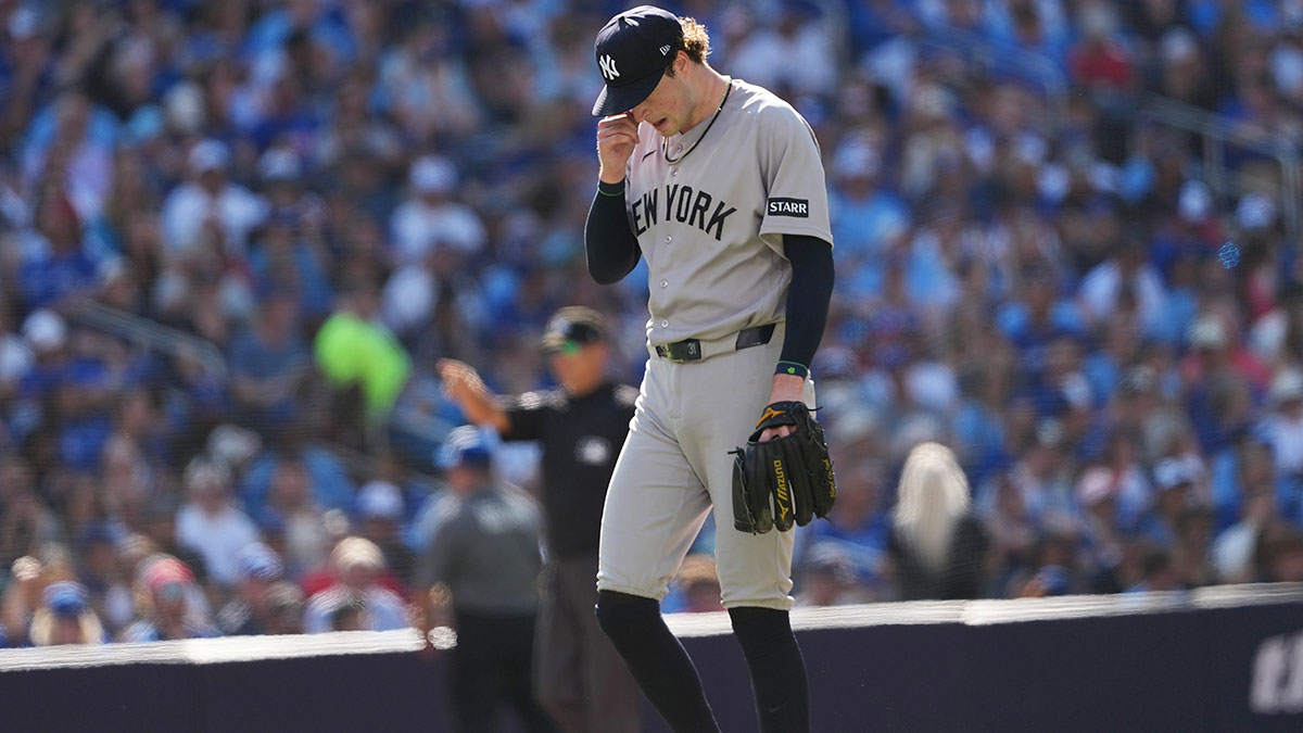 New York Yankees starting pitcher Cam Schlittler (31) walks towards the dugout after being releived against the Toronto Blue Jays during the sixth inning at Rogers Centre. Mandatory Credit: Nick Turchiaro-Imagn Images