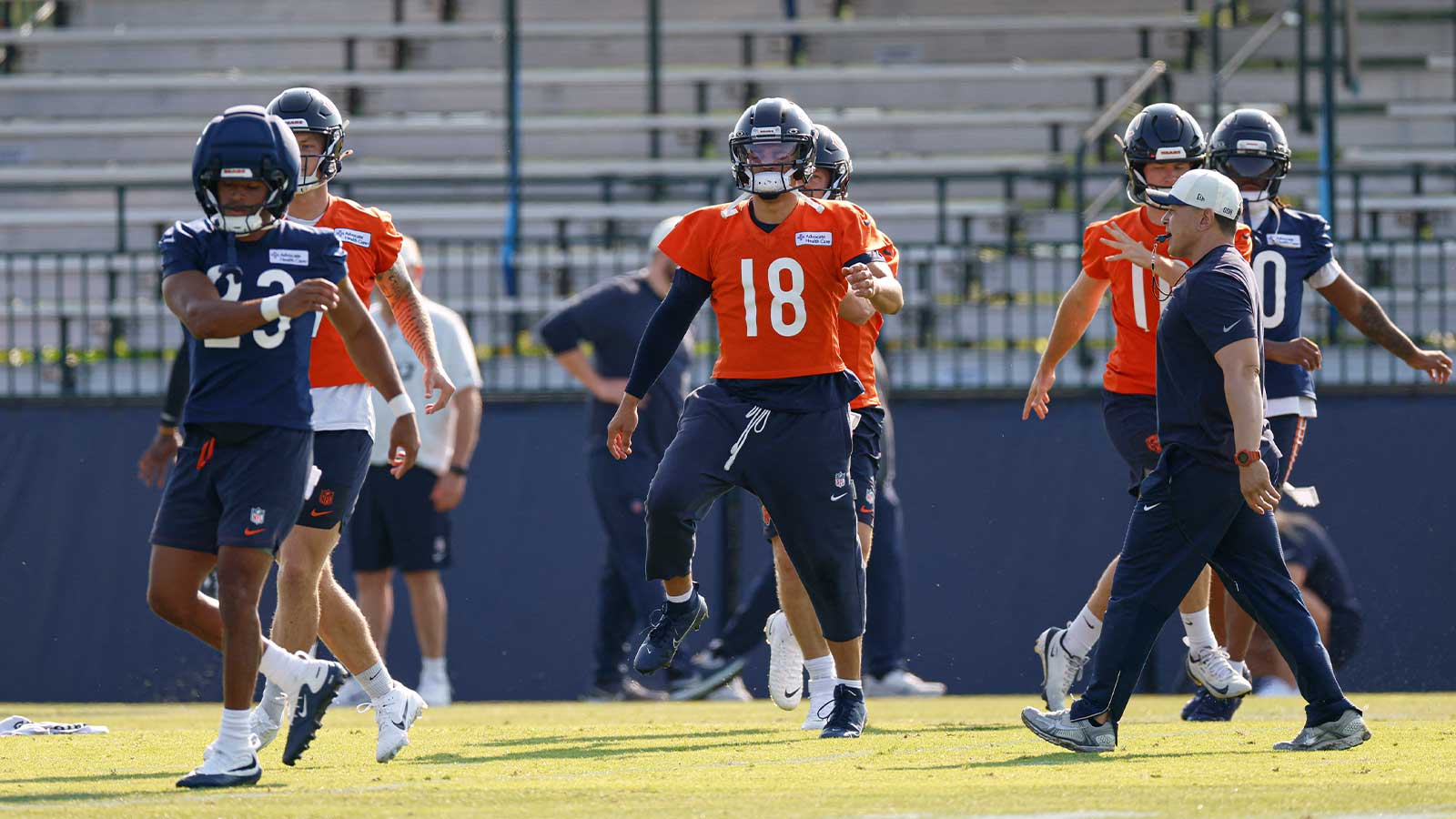 Chicago Bears quarterback Caleb Williams (18) warms up during Training Camp at Halas Hall. 