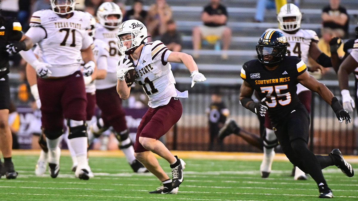 Texas State Bobcats wide receiver Beau Sparks (11) runs the ball while defended by Southern Miss Golden Eagles linebacker Chris Jones (35) at M.M. Roberts Stadium in Hattiesburg,Miss, on Nov. 15, 2025.