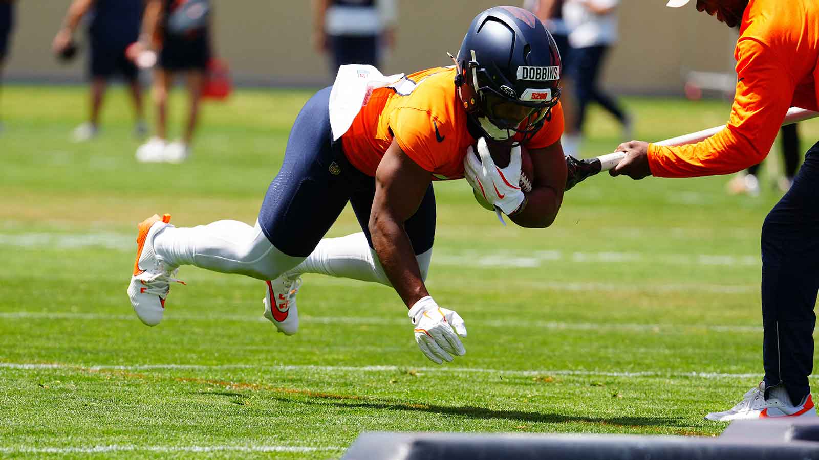 https://wp.clutchpoints.com/wp-content/uploads/2026/08/Broncos-2025-2026-running-back-J.K.-Dobbins-27-during-mini-camp.jpg