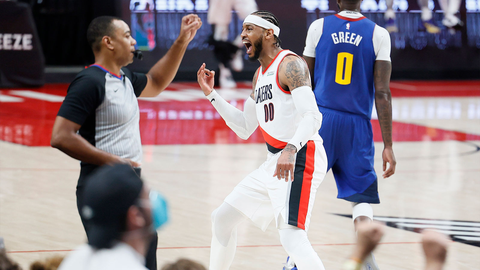 Portland Trail Blazers power forward Carmelo Anthony (00) reacts after a three-point basket during the second half of game three in the first round of the 2021 NBA Playoffs against the Denver Nuggets at Moda Center. 