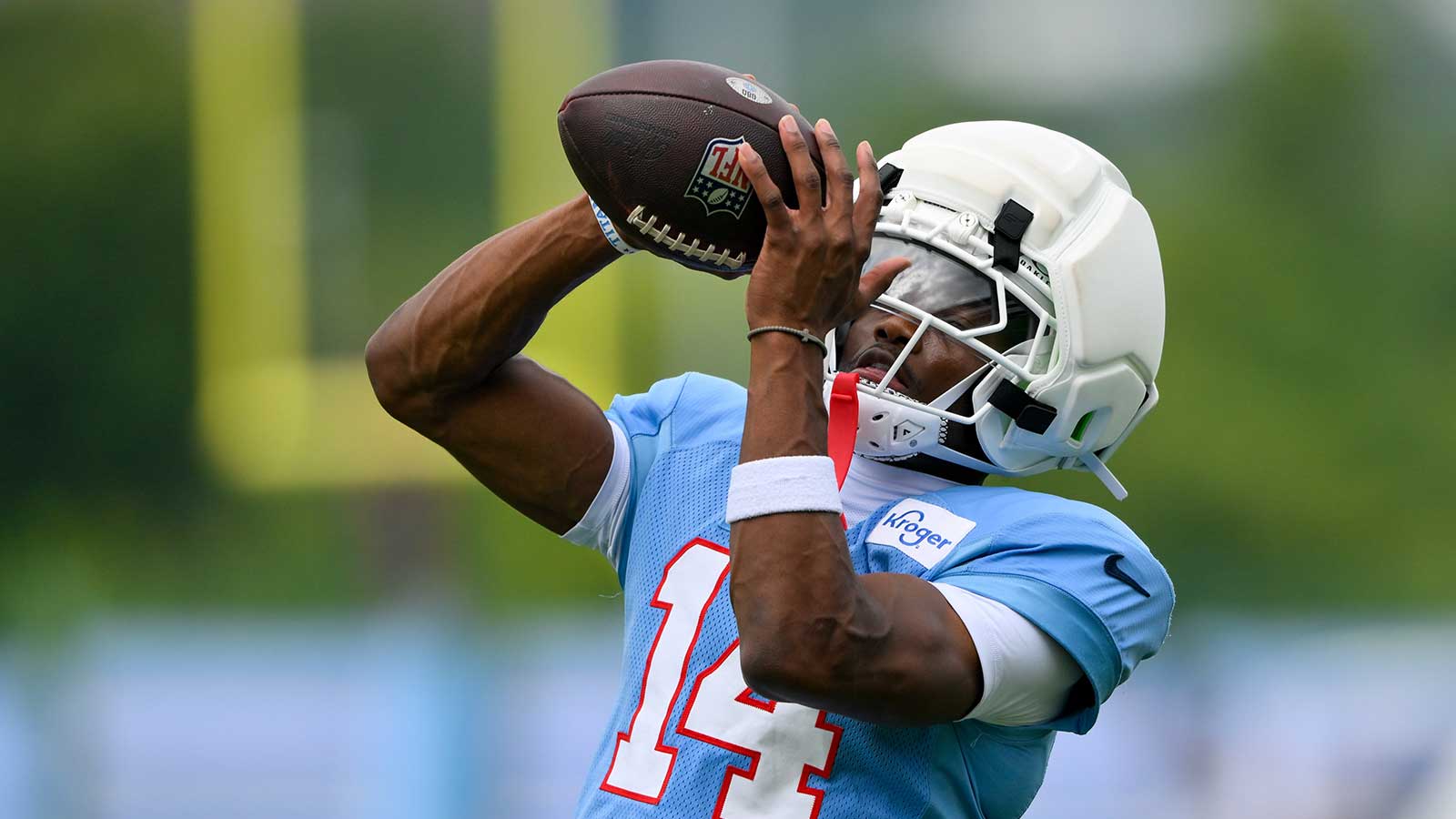 Tennessee Titans wider receiver Carnell Tate (14) makes a catch during training camp at Vanderbilt Health Football Center.