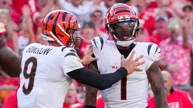 Cincinnati Bengals quarterback Joe Burrow (9) restrains wide receiver Ja'Marr Chase (1) after an altercation with officials during the second half of the game against the Kansas City Chiefs at GEHA Field at Arrowhead Stadium