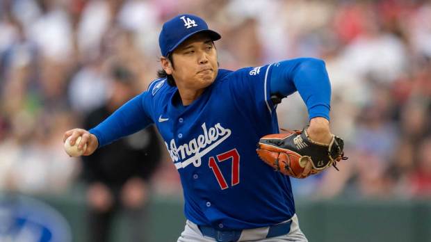 Dodgers starting pitcher Shohei Ohtani (17) delivers a pitch
