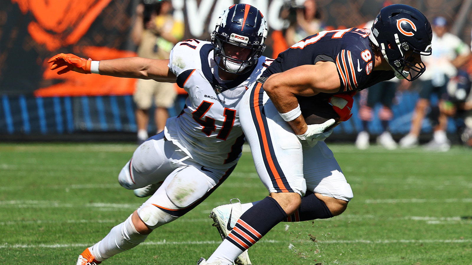 Chicago Bears tight end Cole Kmet (85) makes a catch against Denver Broncos linebacker Drew Sanders (41) during the second half at Soldier Field. 